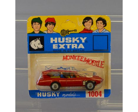 Husky 1004 The Monkees Monkeemobile in red with white roof, no decals to door. Diecast model is E, sealed on VG card, some sm