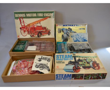 Three boxed plastic model kits by Bandai, including a 'Matra F-1' in 1:12 scale and a 'Steam Road Roller' and '1914 Dennis Fi