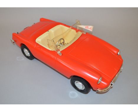 A boxed 'Sindy's Own Car' plastic car, approximately 45cm long, in red and appears to be based on an MG car, overall G+, comp