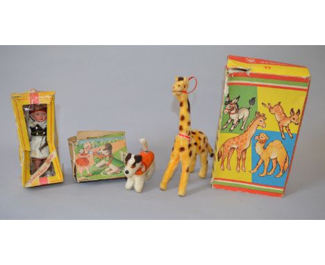 Two Max Carl for Wagner (Western Germany) clockwork animals: Giraffe is 22 cm tall, flock covered, yellow with brown spots an