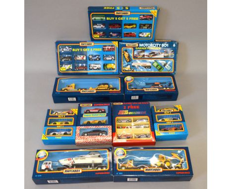Eleven boxed Matchbox  diecast models including MC801 Garage Playpack, two 'Buy 5 get 5 Free' sets and K-126 RN Helicopter an