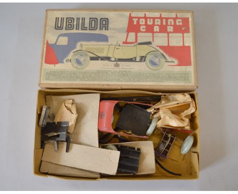 Chad Valley Ubilda Touring Car, unbuilt tinplate model in red with clockwork drive. No instructions, not checked if complete.