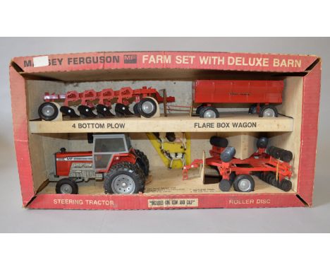 ERTL Massey Ferguson Farm Set with Deluxe Barn, includes diecast model with accessories: Steering Tractor; Roller Disc; 4 Bot