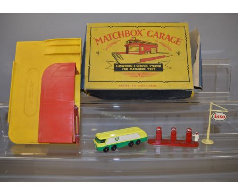 A boxed Matchbox MG-1 'Showroom and Service Station' with yellow base and red building, missing roof sign, otherwise G and ma