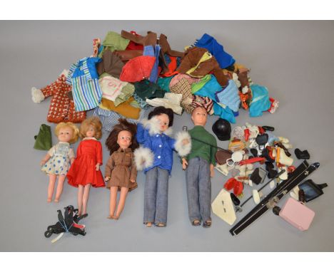 A group of five unboxed clothed dolls including Paul, Sindy, Toots, Patch and Linda,overall G,   together a quantity of cloth