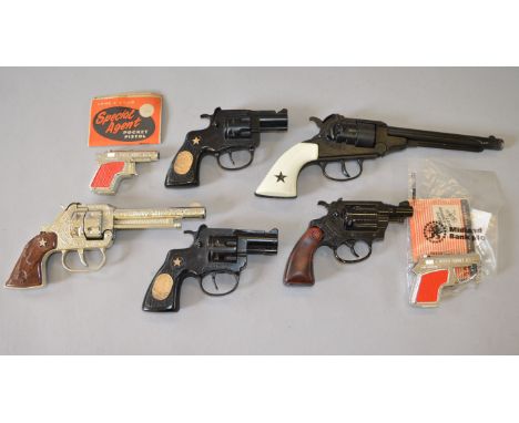 Seven unboxed Lone Star diecast cap-firing toy guns, including two 'Special Agent' Pocket Pistols, unbagged but with header c