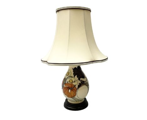 Moorcroft table lamp, of baluster form, decorated with tulips and other flowers upon a white ground with accompanying cream s