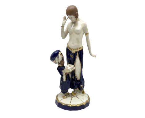 Royal Dux Art Deco figure group of Turkish dancing girl with a young boy beside her holding a casket, decorated with gilding,