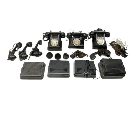 Three vintage Bakelite black telephones, each with chrome dial, together with additional plinths and Bakelite headsets