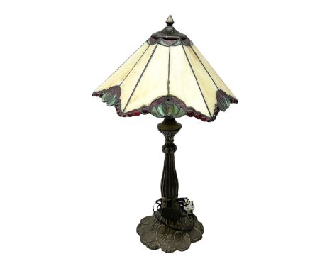 Tiffany style table lamp, with cast bronzed effect base with leaded and coloured glass effect shade, H66cm