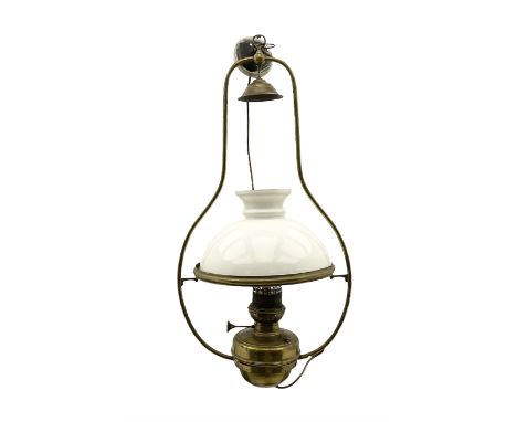 Early 20th century brass oil lamp with opaque glass shade, later converted to electric, H80cm 