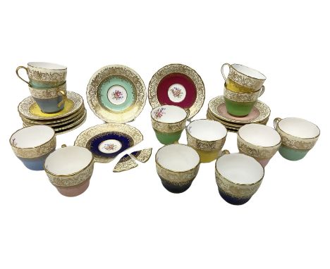 Twelve Spode Ruskin pattern coffee cups and saucers, with floral bouquets, varying colour grounds and gilt