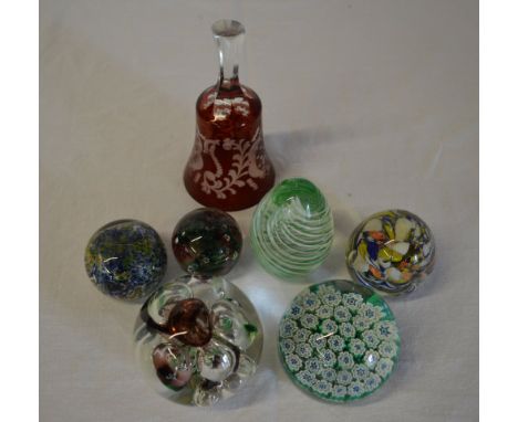 Glass paperweights including Millefiori and a ruby glass bell