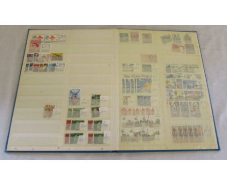 Light blue album of mixed mint and used World stamps