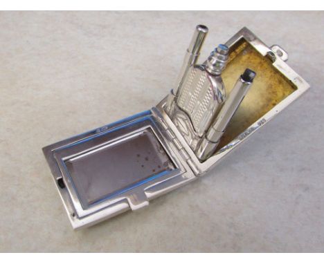 Silver miniature vanity case complete with compact, perfume bottle and two eye liner pencil holders marked Sterling 925/935 w