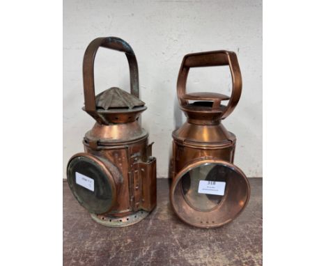 Two railway lamps, one marked Harry Pratt 1945 and with broad arrow and one marked BR 