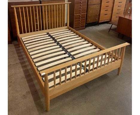 An Ercol oak double bed 