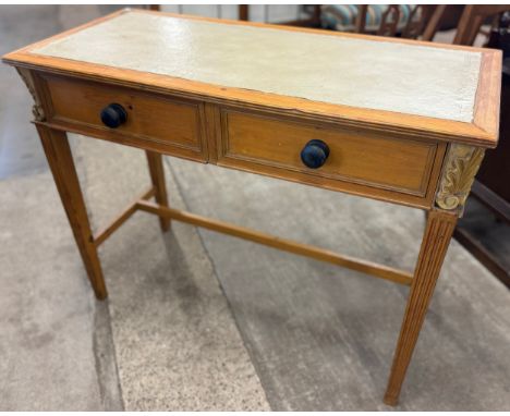 A French pine and cream leather topped two drawer console table 