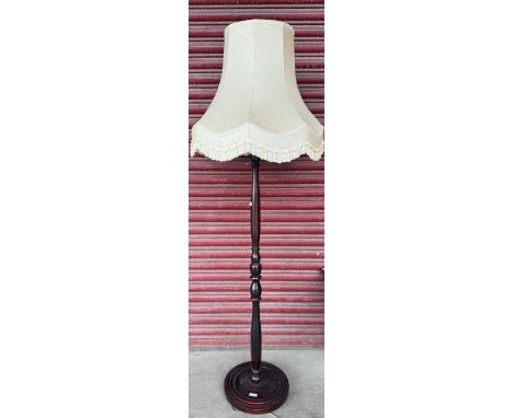 A mahogany standard lamp 