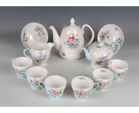 A Shelley Wild Flowers pattern part tea service, comprising cake plate, small teapot and cover, jug, sugar bowl, six teacups 