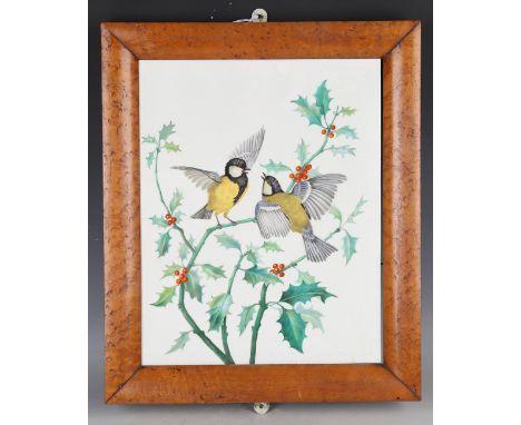 A decorative ceramic rectangular wall tile, designed as a pair of great tits amongst holly branches, 38.3cm x 30.7cm, within 