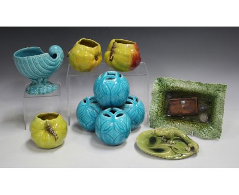 A small group of art pottery, late 19th/early 20th century, including a Bretby kitten with a ball of wool, a Bretby grotesque