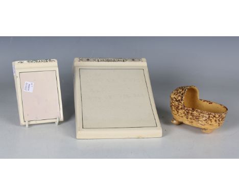 A Staffordshire pottery model of a child's cradle or crib, early 19th century, the mustard glazed basketweave moulded body wi