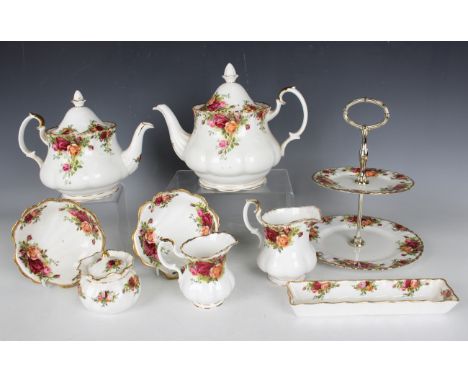 A Royal Albert Old Country Roses pattern part service, some second quality, comprising a two-tier cake stand, two teapots and