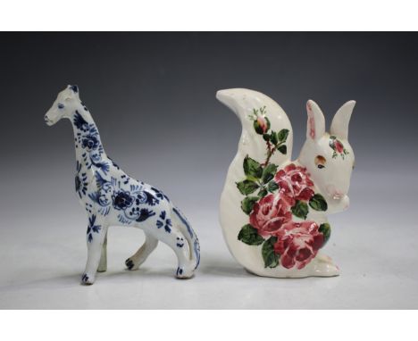 A Brian Adams Exon Wemyss pottery model of a squirrel, painted with pink cabbage roses, green painted marks to base, height 1