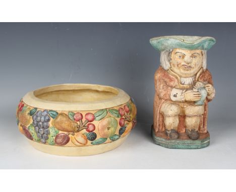 A Compton pottery bowl, the sides moulded with fruit, impressed mark to base, diameter 21.5cm, together with a pottery Toby j