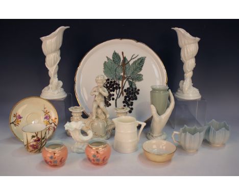 Two Royal Worcester white glazed shell flower holders, circa 1962, shape No. 2351, height 22.5cm, together with a small group