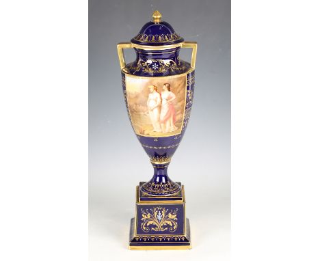 A cobalt blue ground 'Vienna' porcelain vase and cover, late 19th century, the urn shaped body painted by A. Heer, signed, wi