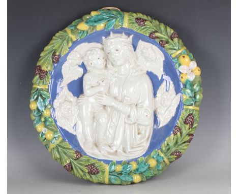 A Cantagalli Della Robbia style pottery roundel, late 19th century, modelled in high relief with the Virgin Mary and Christ i