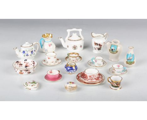 A mixed group of porcelain and pottery miniatures, mostly teawares, 19th and 20th century, including a Spode puce ground jug,