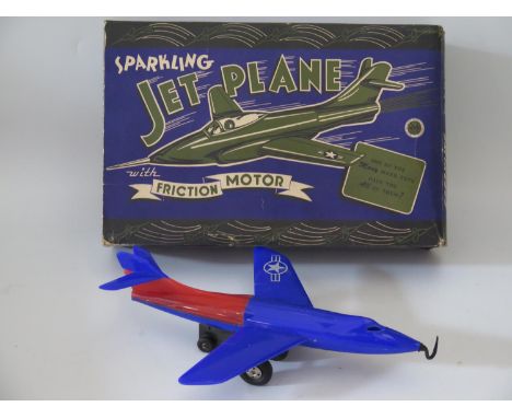 Plastic Toy _ A Marx Sparkling Skyrocket Jet Plane with friction motor, 29cm. Manufactured in 1950 and complete with original