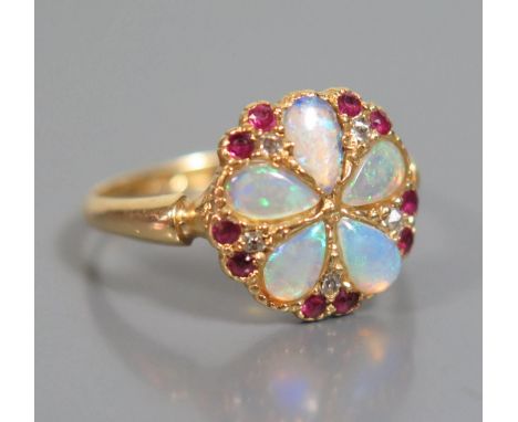 A White Opal and Ruby Ring in 18ct yellow gold setting, size M.5, 3g 