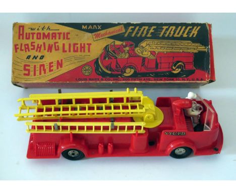 Plastic Toy _ A Marx NYCFD Mechanical Fire Truck with automatic flashing light and siren, 33cm Manufactured 1953 and complete