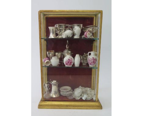 A Collection of Doll's House Miniature Silver, Porcelain and Glass. Including Edwrad VII four part silver tea set Birmingham 