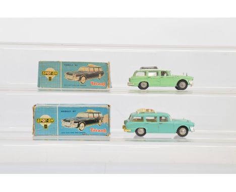 Two boxed Tri-ang Spot-On  183 Humber Super Snipe Estate  models, one in pastel green with a white roof and roof rack, missin