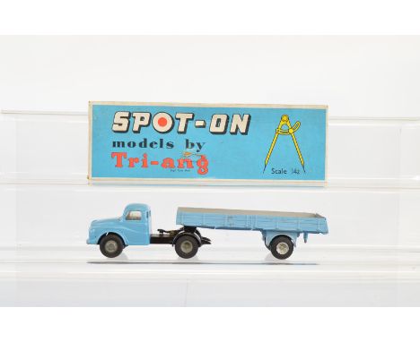 A boxed Tri-ang Spot-On 106A/1 Austin Prime Mover,  with Articulated Flat Float with Sides in light blue, appears G/G+ in  a 