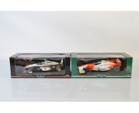 Two Paul's Model Art Minichamps McLaren Collection Formula 1 1/18 scale models, McLaren Mercedes MP4/12 D. Coulthard and McLa