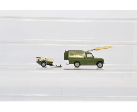 A scarce  unboxed Tri-ang Spot-On 419 Army Rocket Launcher Land Rover and Trailer, appears   complete with two rockets in pos