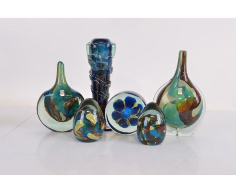 Six pieces of Mdina glass ware, including two bottle/axe head vessels, two domed paperweights, a vases and a cylindrical pape