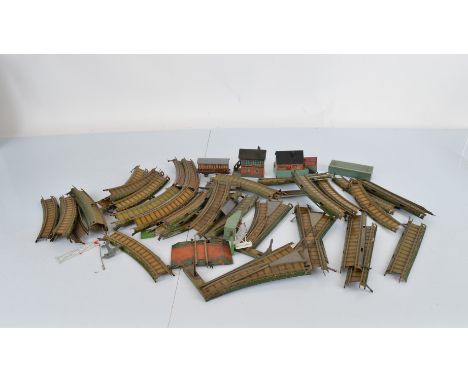 A small collection of Bing model railway accessories, including lithographed tinplate buildings, track, points, etc