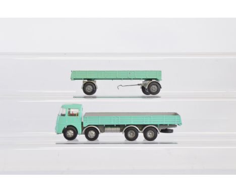 Two Tri-ang Spot-On Commercial Vehicle models, a 109/3 ERF 68G Flat Float with Sides together with a  B106 4 wheel 10 Ton Tra