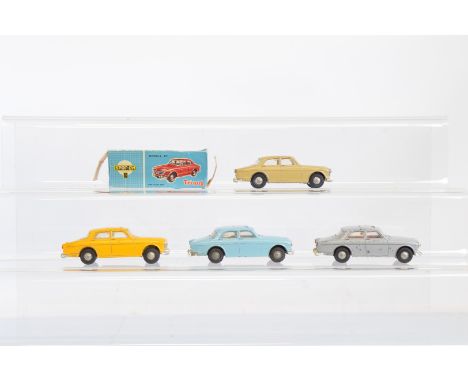 Four Tri-ang Spot-On 216 Volvo 122S models, including a beige model, G in a P  box together with three unboxed models – light