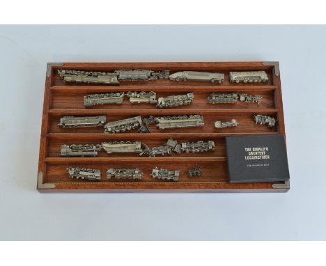 A collection of Franklin Mint The World's Greatest Locomotives, with display shelf and certificates