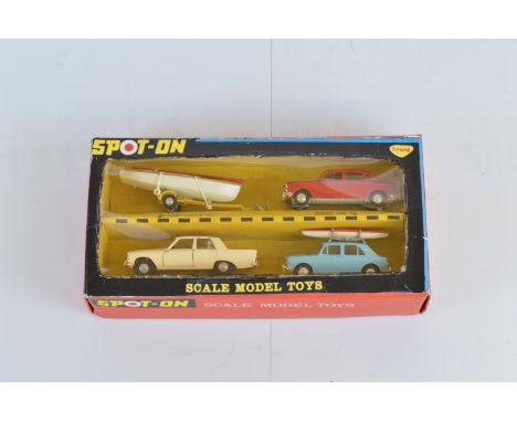 A Tri-ang Spot-On 702 Four Car Gift Pack, including Austin 1800 in red, F/G, a Ford Zephyr 6 in cream ,G, and an Austin 1100 