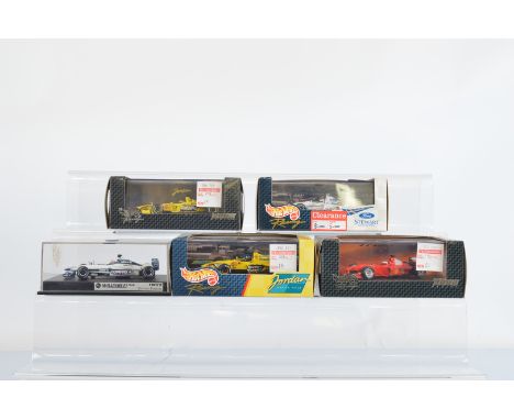 Five Hotwheels Racing 1:43 scale Formula One models, 22811, 26749, 24527, 26754 and Williams FW22 Jenson Button model, all ca