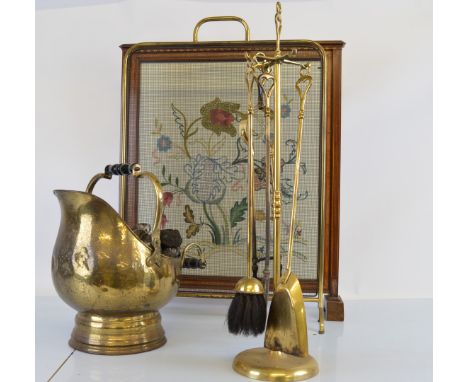 A collection of mid to late 20th century fire furniture, including a wooden framed fire screen, floral textile centre and inl